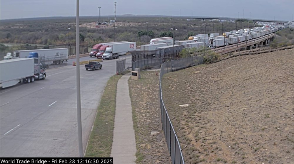 Webcam image showing long lines of trucks from the Mexican side of the Laredo port